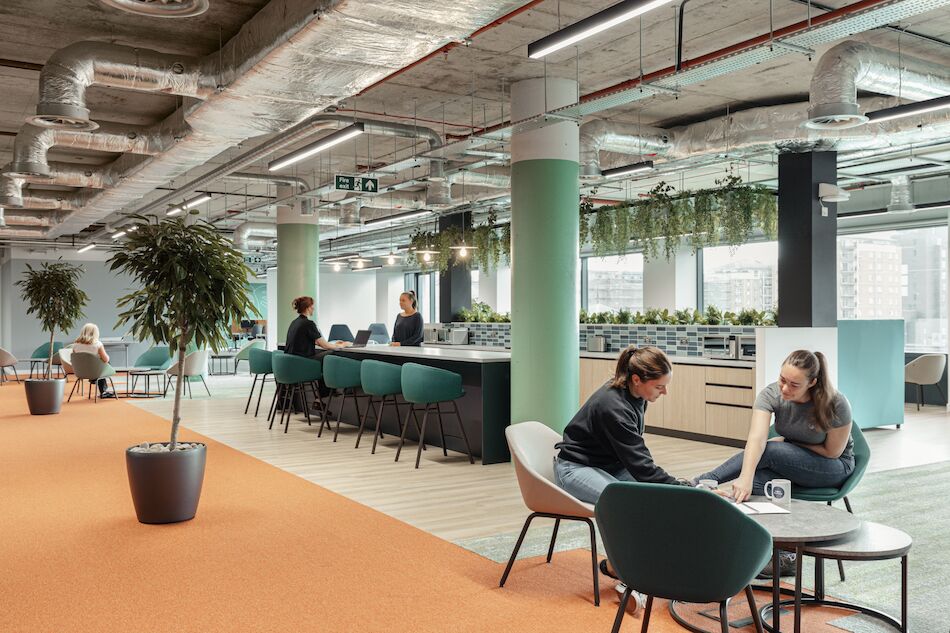 Employees working in open office space